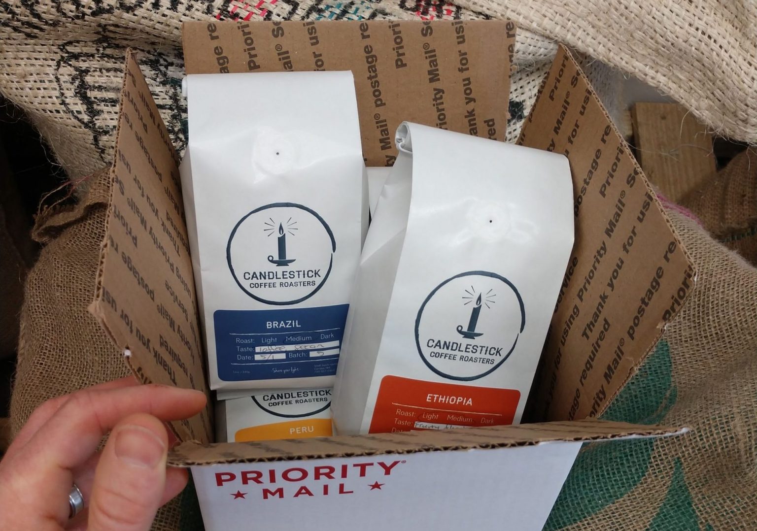 A Candlestick Coffee Subscription box, ready to deliver fresh, specialty coffee to your doorstep.