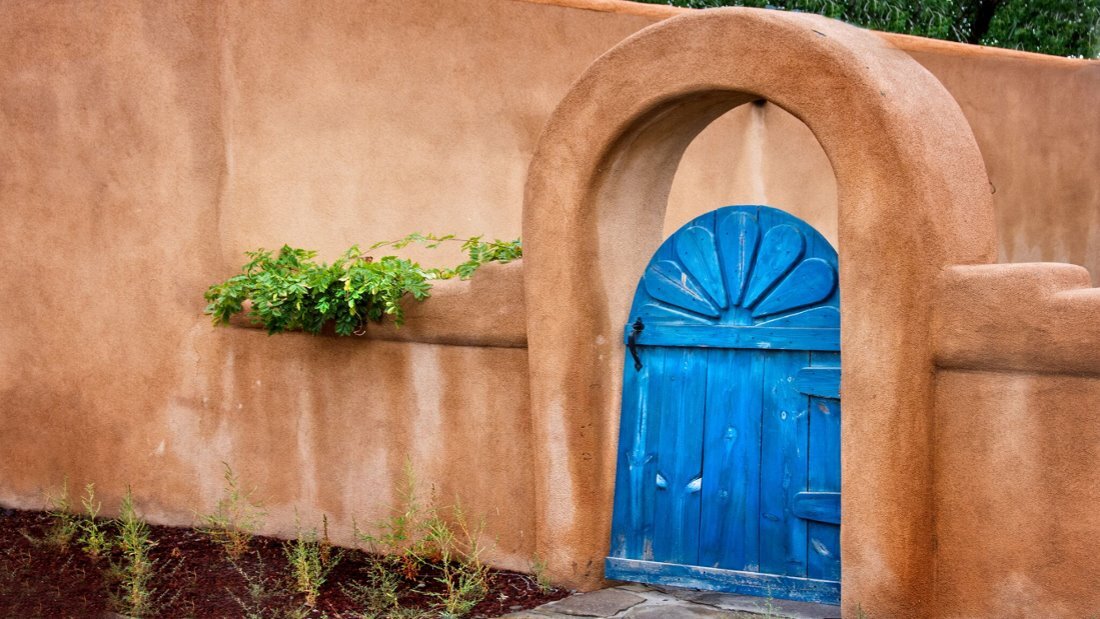 The inviting entrance of a Corrales bed and breakfast, welcoming visitors to explore historical and cultural charm.